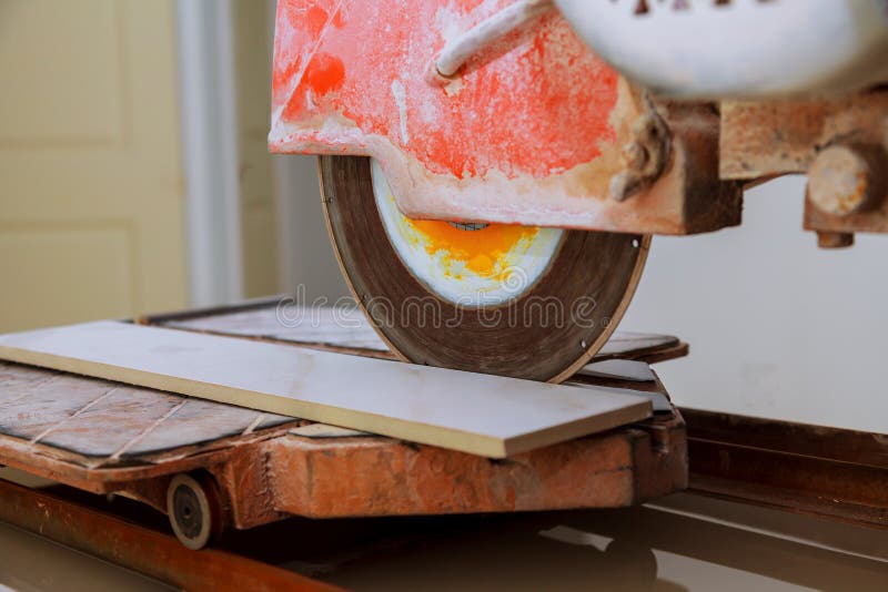 Cutting Porcelain Tiles Using a Diamond Blade Saw. Stock Photo Image