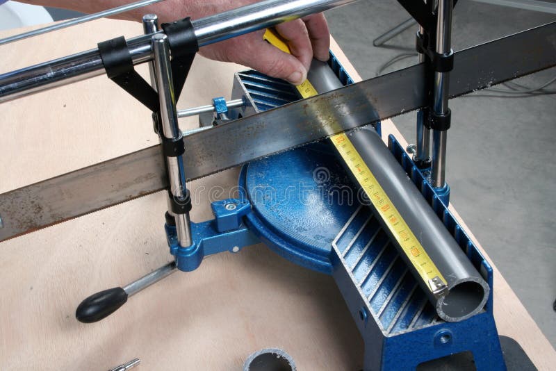 Cutting pvc pipe stock image. Image of concentration 73593705