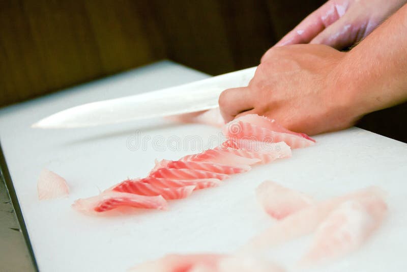 Cutting red fish knife stock image. Image of blade, meat 15393599
