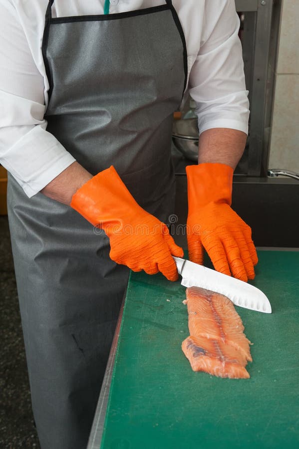 Cutting salmon fish stock photo. Image of knife, food 76246330