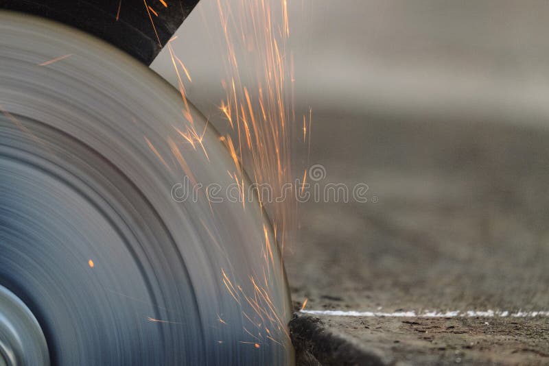 Cutting Sheet Steel Structures an Electric Cutoff Wheel Grinding Machine Closeup Stock Photo