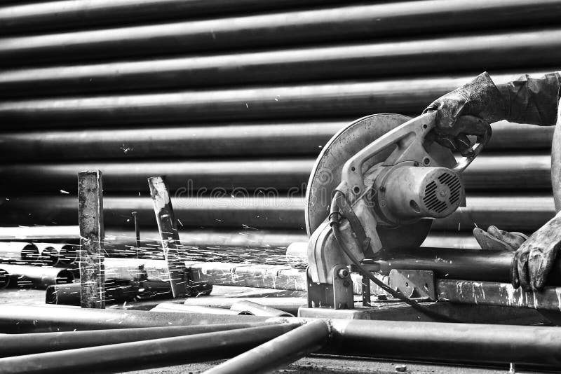 Cutting Steel With Machine For Cutting Steel By Worker Stock Photo