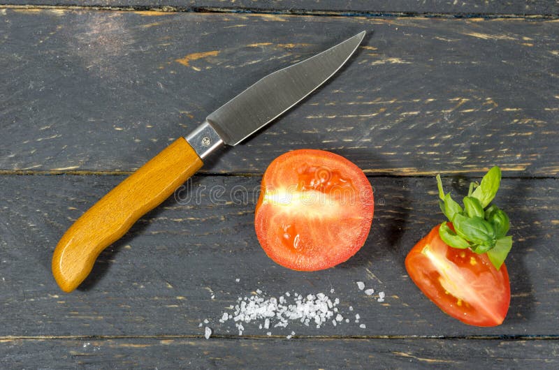 Cutting Tomatoes with a Sharp Pocket Knife. Stock Image Image of