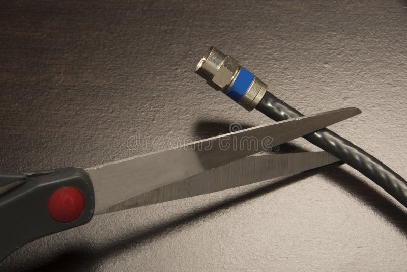 Cutting the cable on Tv stock image. Image of global 52975847