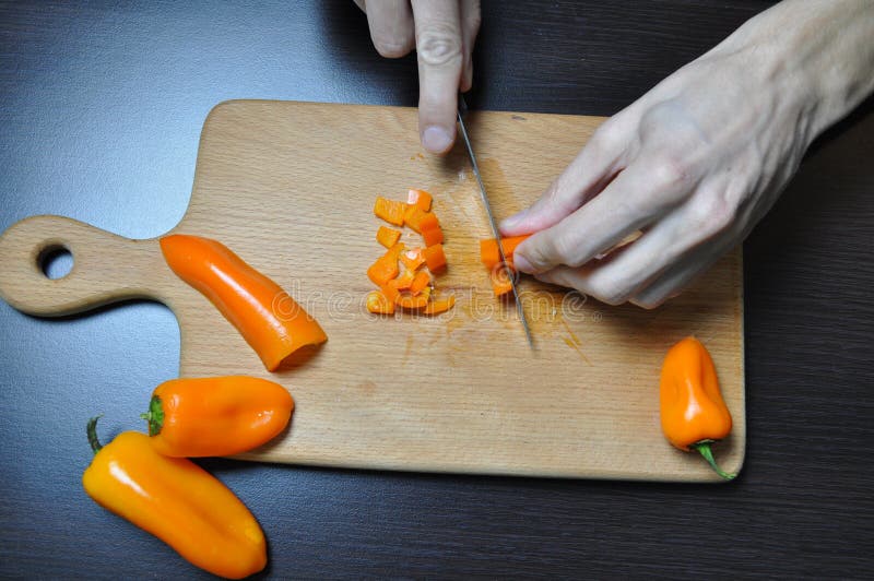 Cutting Vegetables, a Knife in Hands, on a Board Stock Photo Image of