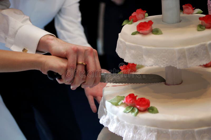 Cutting the Wedding Cake stock photo. Image of tradition 4404682