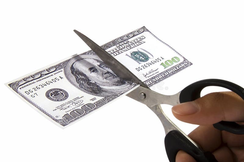 Scissors cutting an one hundred dollar note. Scissors cutting an one hundred dollar note.