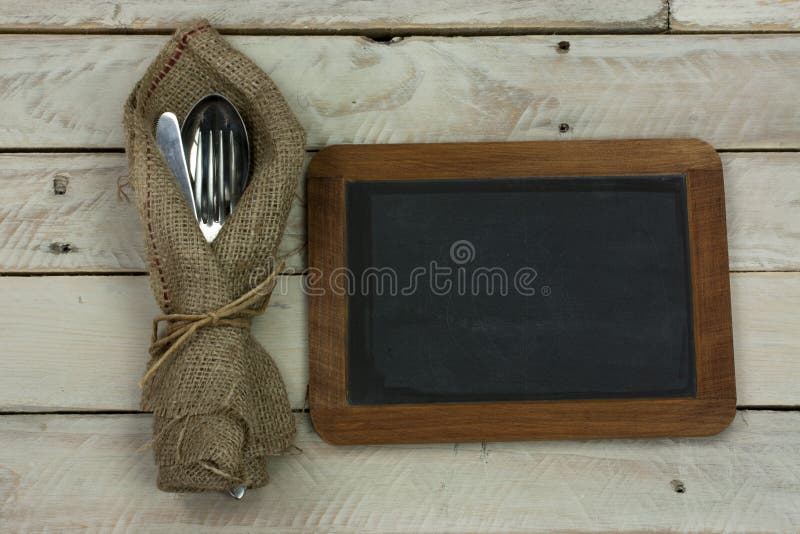 Cuttlery on a rustic wooden background