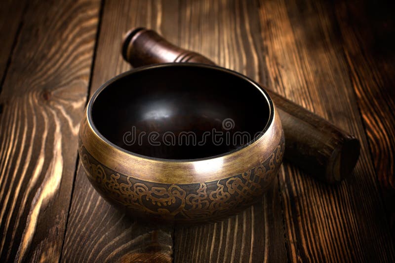 Tibetan Singing bowl on the table. Tibetan Singing bowl on the table