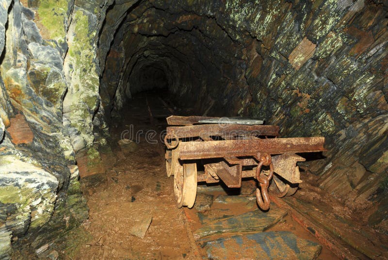 Abandoned mine level and cart at Cwmorthin slate mine, Snowdonia. Abandoned mine level and cart at Cwmorthin slate mine, Snowdonia