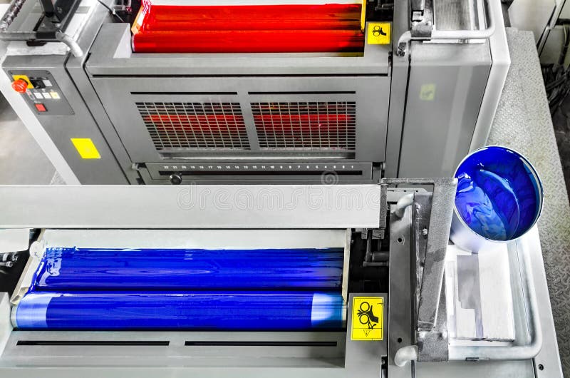 Cyan and magenta printing unit on offset print machine stock photography