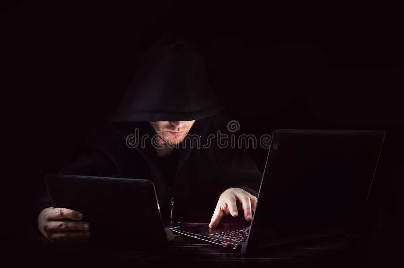 Cyber attack with unrecognizable hooded hacker royalty free stock images Cyber attack with unrecognizable hooded hacker royalty free stock images