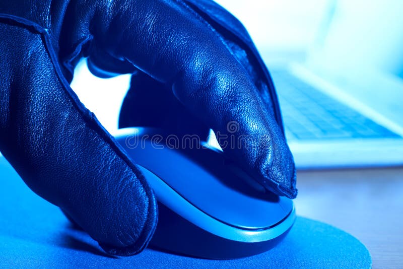 Close Up Of Cyber Criminal In Gloved Hand Using Computer Mouse stock images