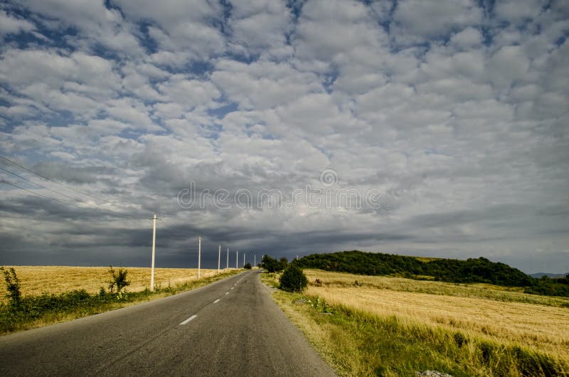Cycling mountain road. Misty mountain road in high mountains. Cloudy sky with mountain road of Azerbaijan royalty free stock photo Cycling mountain road. Misty mountain road in high mountains. Cloudy sky with mountain road of Azerbaijan royalty free stock photo