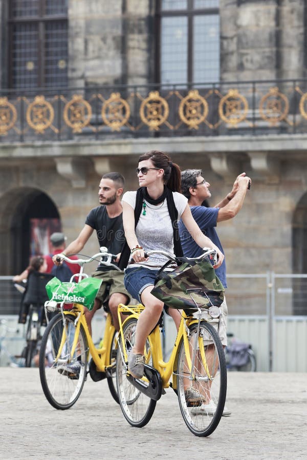 Cycling Tourists on Amsterdam Dam Square Editorial Stock Photo Image