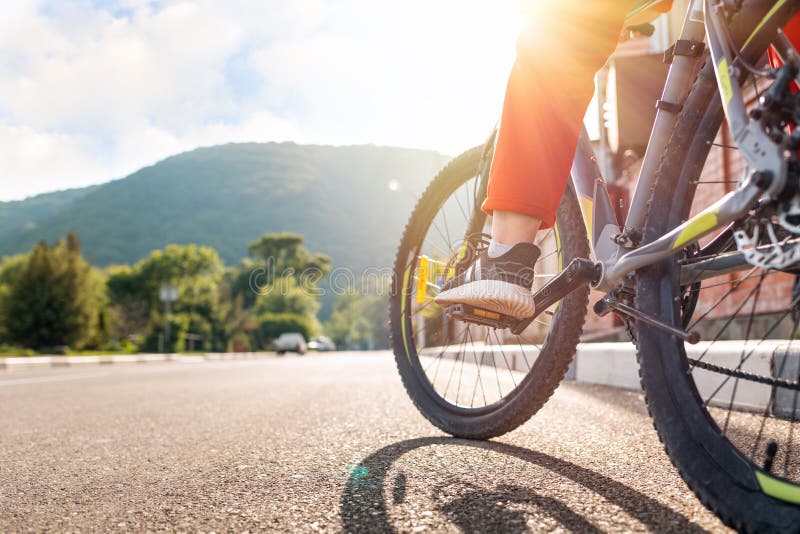 Cycling. a Woman in Red Sportswear is Sitting on a Bicycle with Her ...