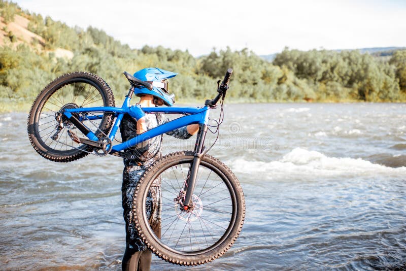 Cyclist with bicycle on the mountains royalty free stock photos Cyclist with bicycle on the mountains royalty free stock photos