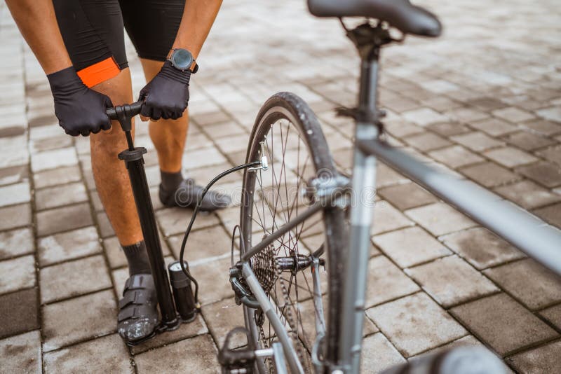 Cyclist Fill Up the Air of His Bike& X27;s Wheel Stock Image - Image of ...