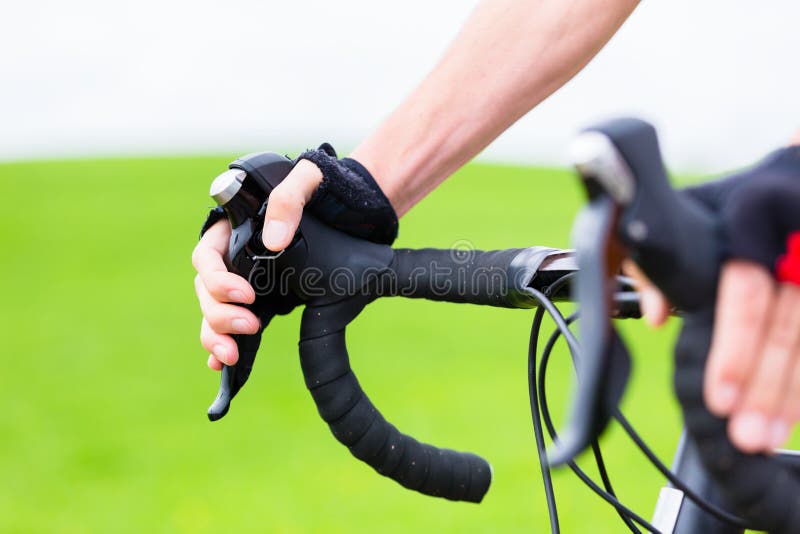 Cyclist on race bike pedaling on bike track