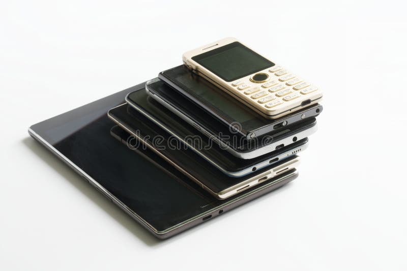 Smartphones, digital tablet and mobile phone of different generations on a white background. Modern digital gadgets. Type-c and micro USB connectors. Copy space. Daylight. Smartphones, digital tablet and mobile phone of different generations on a white background. Modern digital gadgets. Type-c and micro USB connectors. Copy space. Daylight