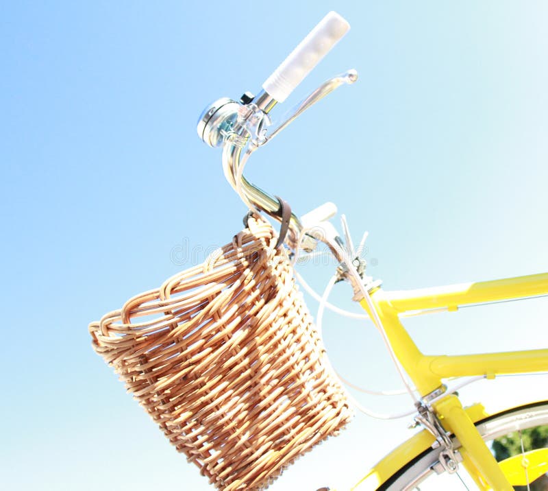 Retro Summer Yellow Bike with basket at front. Retro Summer Yellow Bike with basket at front.