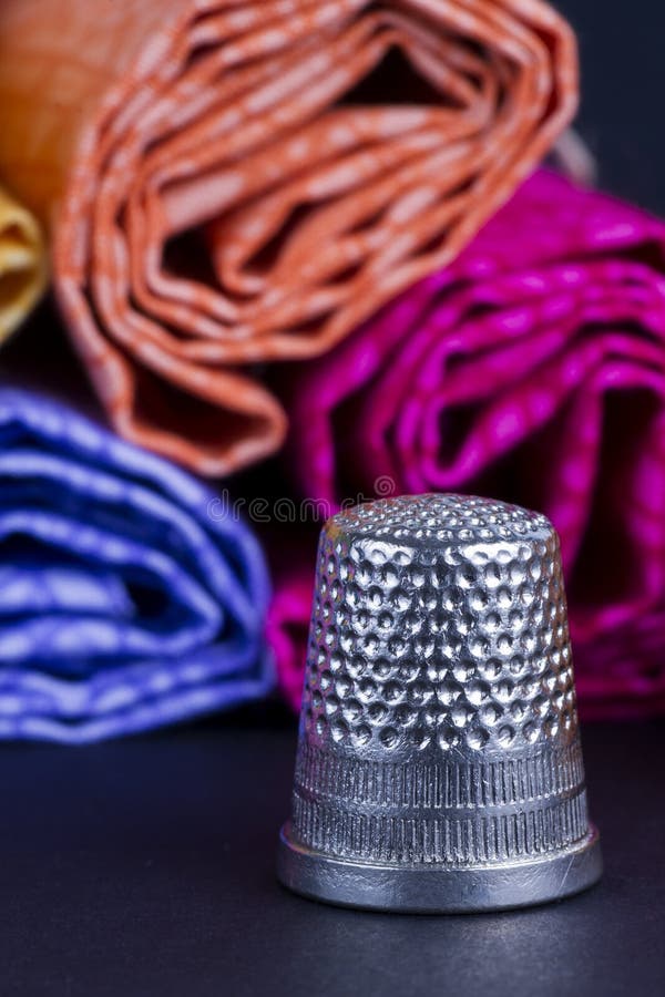Cylinders of Colorful Fabric and Metal Thimbl Stock Image Image of