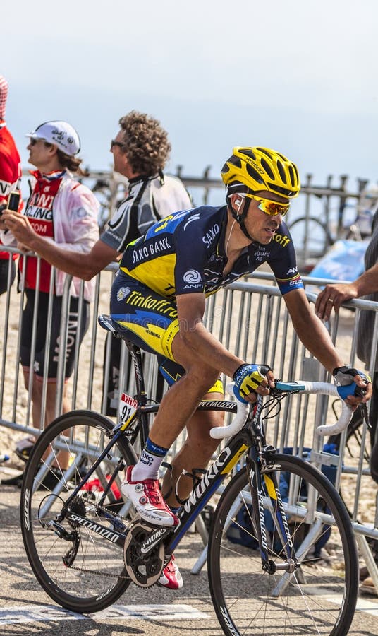 Mont Ventoux, France- July 14 2013: The Spanish cyclist Alberto Contador (Team Saxo Thinkoff), climbing the last kilometer of the ascension to Mont Ventoux during the stage 15 of the 100 edition of Le Tour de France 2013. Mont Ventoux, France- July 14 2013: The Spanish cyclist Alberto Contador (Team Saxo Thinkoff), climbing the last kilometer of the ascension to Mont Ventoux during the stage 15 of the 100 edition of Le Tour de France 2013.