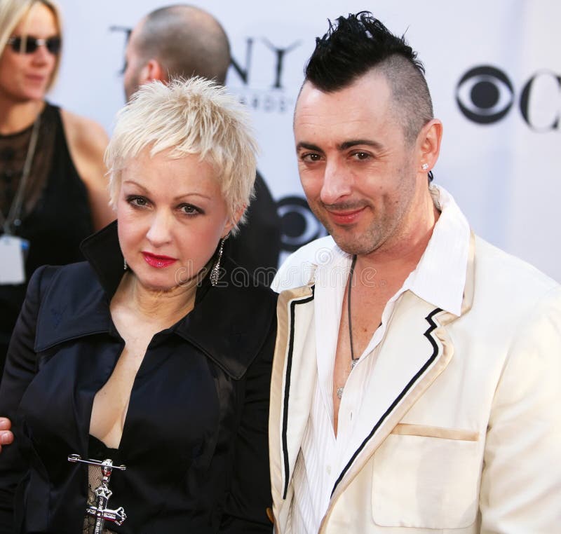 Pop singer,songwriter and actress Cyndi Lauper and Scottish actor Alan Cumming make a colorful entrance onto the red carpet at the Radio City Music Hall in New York City for the 60th Annual Tony Awards on June 11, 2006. Pop singer,songwriter and actress Cyndi Lauper and Scottish actor Alan Cumming make a colorful entrance onto the red carpet at the Radio City Music Hall in New York City for the 60th Annual Tony Awards on June 11, 2006.