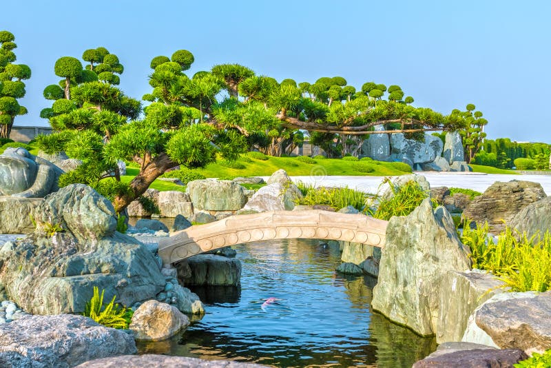 Cypresses emerge to the stone bridge