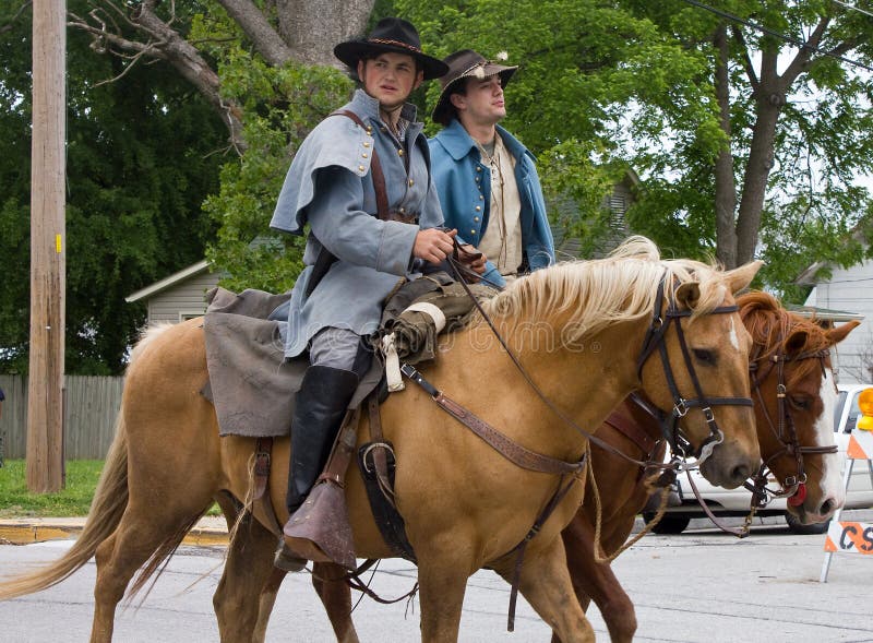 A pair of young men on horseback ride to Central Park to reenact The Battle of Carthage, Missouri on the 150th Anniversary of the battle. A pair of young men on horseback ride to Central Park to reenact The Battle of Carthage, Missouri on the 150th Anniversary of the battle.