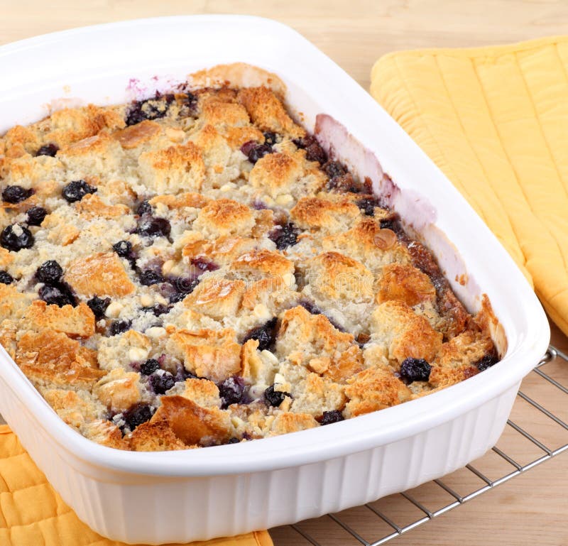 Blueberry cobbler in a baking dish cooling on a wire rack. Blueberry cobbler in a baking dish cooling on a wire rack