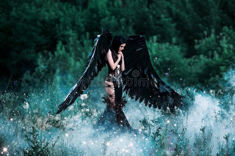 Black Angel. Pretty girl-demon with black wings. An image for Halloween. Image of an old book of fairy tales. Fashionable toning with noise. Black Angel. Pretty girl-demon with black wings. An image for Halloween. Image of an old book of fairy tales. Fashionable toning with noise