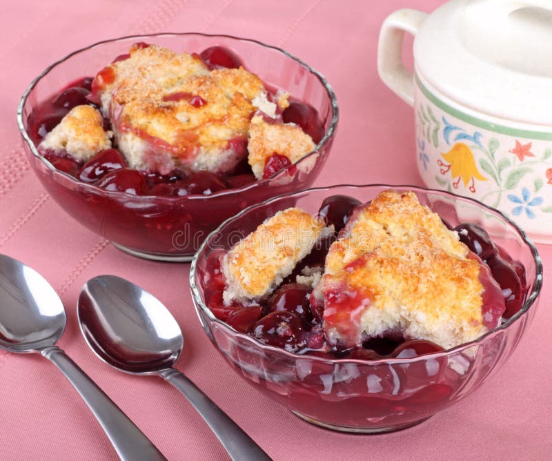 Two cherry cobbler desserts in a bowl. Two cherry cobbler desserts in a bowl