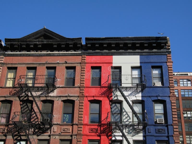 This is a shot of a couple of colorful and patriotic painted apartment buildings located in Manhattan. This is a shot of a couple of colorful and patriotic painted apartment buildings located in Manhattan.