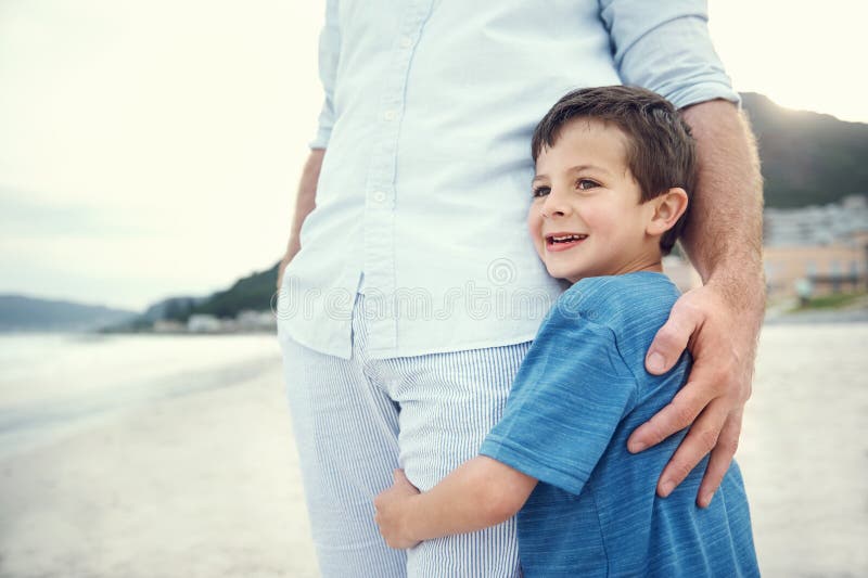 Feeling of safety and security, love hug from father and son at beach. Feeling of safety and security, love hug from father and son at beach