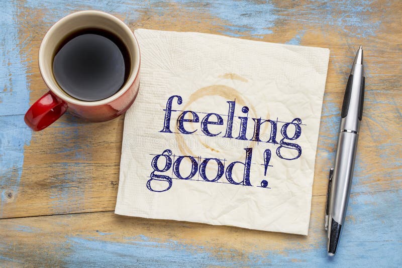 Feeling good handwriting on a napkin with a cup of coffee. Feeling good handwriting on a napkin with a cup of coffee