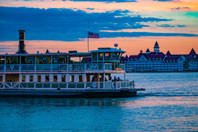 Orlando, Florida. April 23, 2019. Partial view of Disney Ferry and Grand Floridian Resort & Spa on beautiful sunset background at Walt Disney World  area 1. Orlando, Florida. April 23, 2019. Partial view of Disney Ferry and Grand Floridian Resort & Spa on beautiful sunset background at Walt Disney World  area 1