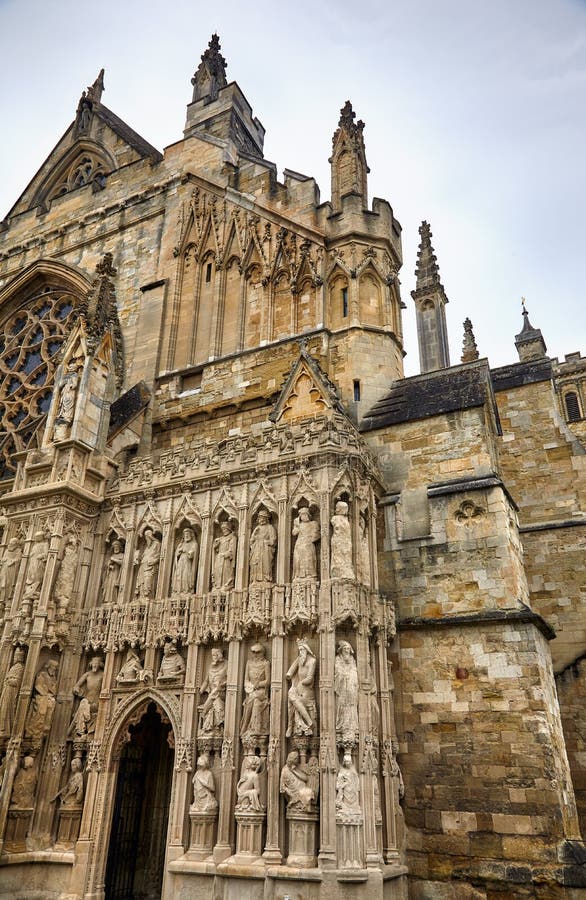 The part of the West facade of Exeter Cathedral with Front Image Screen covered in a wealth of carving, dominated by three rows of statues in niches. Exeter. Devon. England. The part of the West facade of Exeter Cathedral with Front Image Screen covered in a wealth of carving, dominated by three rows of statues in niches. Exeter. Devon. England