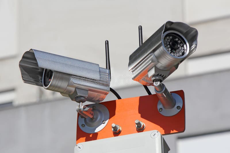 Two security cameras for monitoring building structure. Two security cameras for monitoring building structure