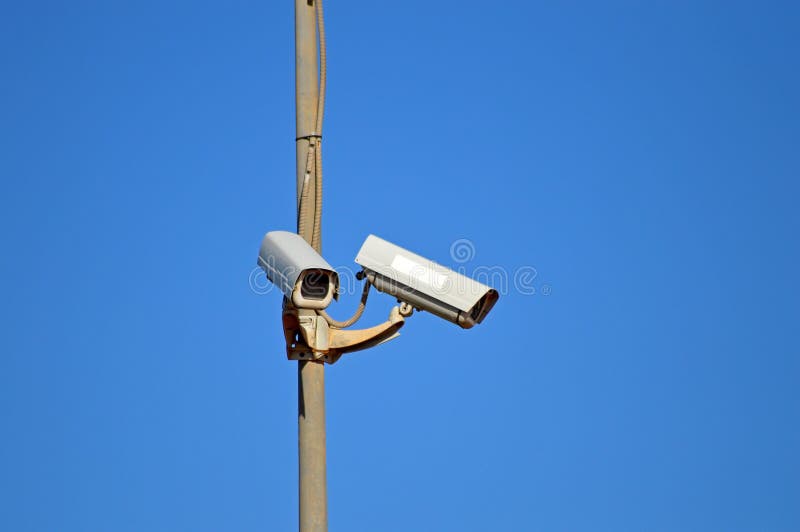 Surveillance Cameras guarding a car park in Spain. Surveillance Cameras guarding a car park in Spain.