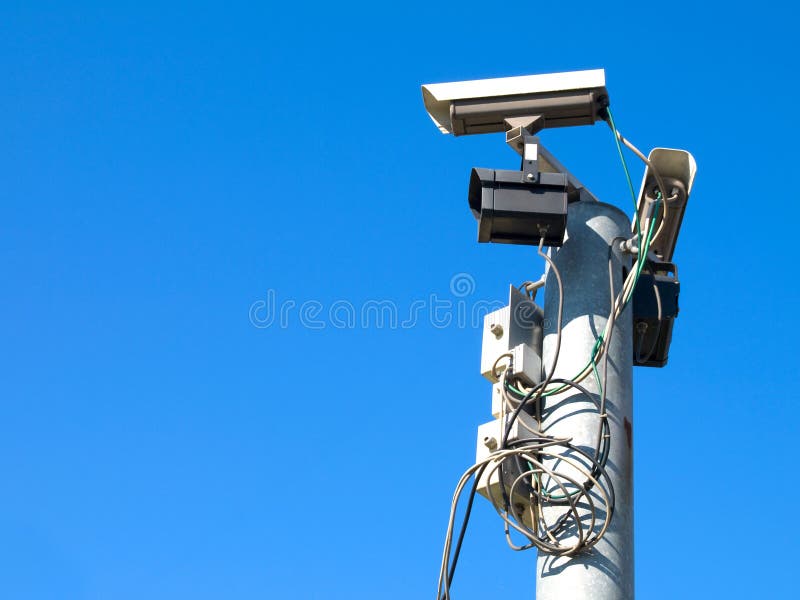 Surveillance cameras against blue sky. Surveillance cameras against blue sky