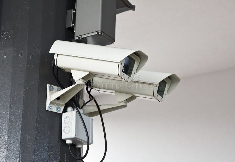 Outdoor surveillance cameras on the wall. Outdoor surveillance cameras on the wall