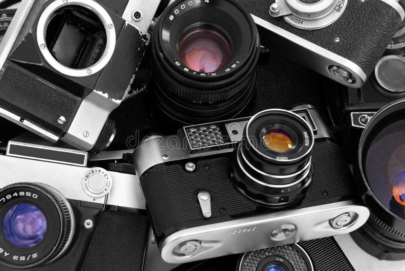 Pile of vintage cameras in black and white. Pile of vintage cameras in black and white