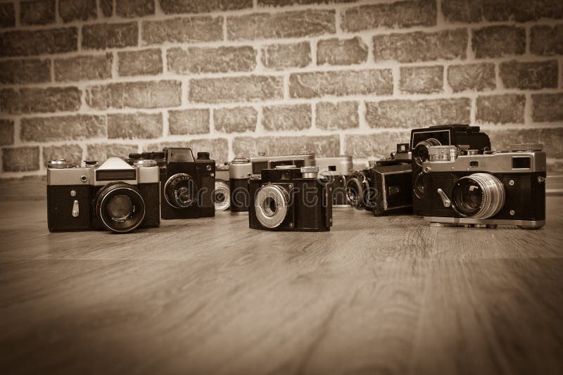 Old cameras on a wood old photo. Old cameras on a wood old photo