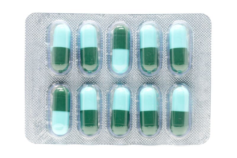 Cápsula de gelatina antibiótica dos comprimidos do verde azul no bloco de bolha fotos de stock Cápsula de gelatina antibiótica dos comprimidos do verde azul no bloco de bolha fotos de stock