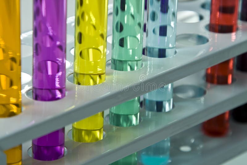 Colorful image and interesting reflections on a test tubes stand; unmodified specific lighting for a laboratory. Colorful image and interesting reflections on a test tubes stand; unmodified specific lighting for a laboratory.