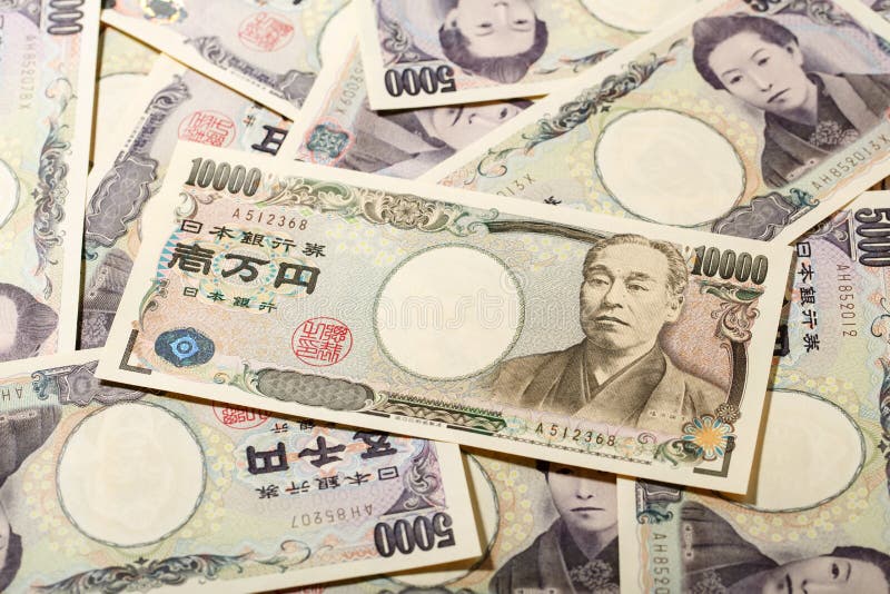 Japanese bank note 10000 yen on 5000 yen background. Japanese bank note 10000 yen on 5000 yen background