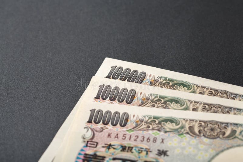 Three Japanese bank note 10000 yen on black background. Three Japanese bank note 10000 yen on black background