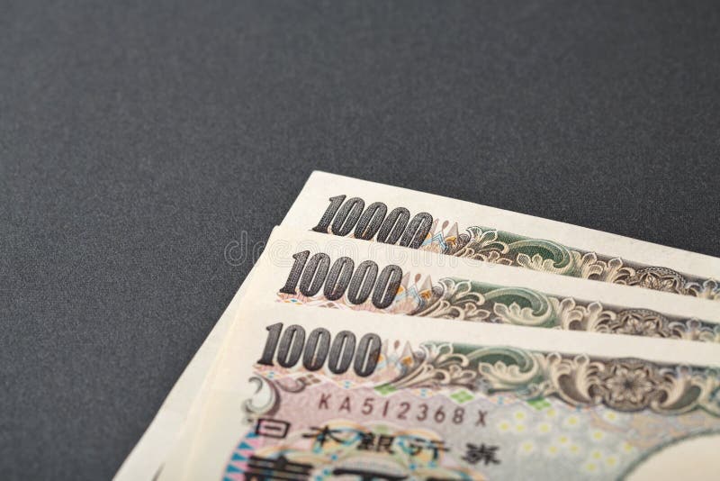 Three Japanese bank note 10000 yen on black background. Three Japanese bank note 10000 yen on black background