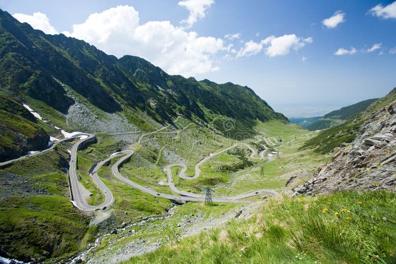 Landscape in Fagaras mountains, with Transfagarasan - the most famous road in Romania, breaking through the mountain. Landscape in Fagaras mountains, with Transfagarasan - the most famous road in Romania, breaking through the mountain